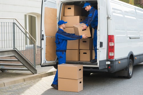 Professional movers preparing a truck for relocation in London