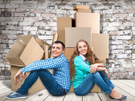 Professional movers handling office equipment in London